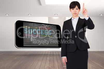 Composite image of focused businesswoman pointing