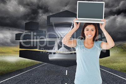 Composite image of gorgeous woman posing with her laptop