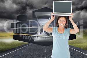Composite image of gorgeous woman posing with her laptop