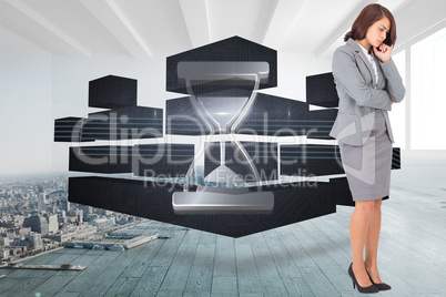 Composite image of focused businesswoman