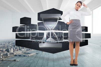 Composite image of focused businesswoman