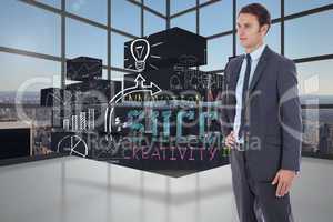 Composite image of serious businessman with hand on hip