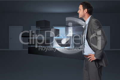 Composite image of smiling businessman with hands on hips