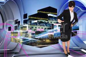 Composite image of businesswoman pointing
