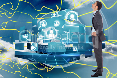 Composite image of serious businessman with hands on hips