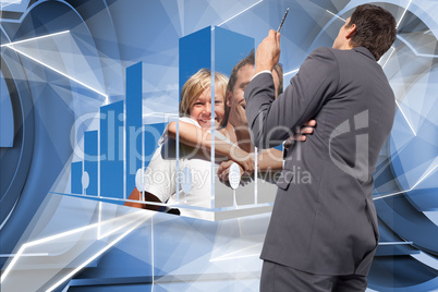 Composite image of thinking businessman holding pen