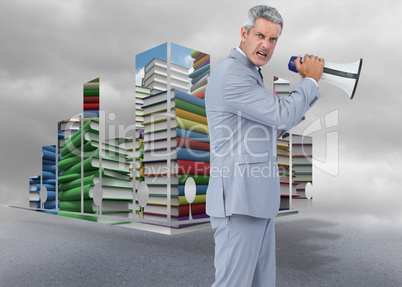 Composite image of furious businessman posing with loudspeaker