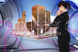 Composite image of businesswoman pointing