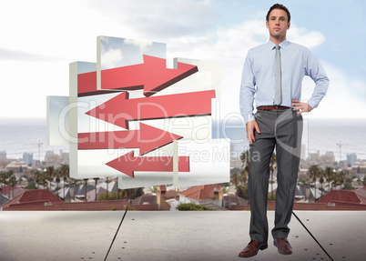 Composite image of serious businessman with hand on hip