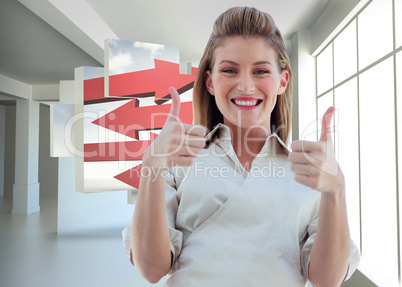 Composite image of businesswoman smiling at the camera with thum