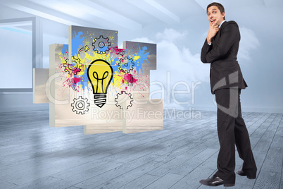 Composite image of thinking businessman touching chin