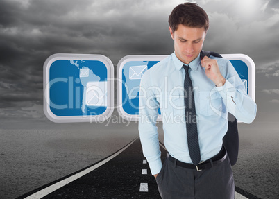 Composite image of serious businessman holding his jacket