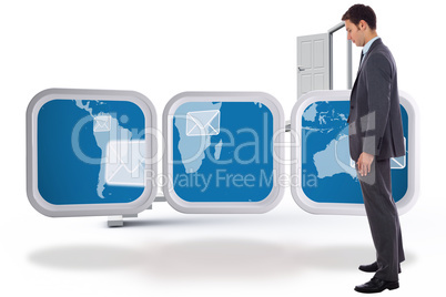 Composite image of serious businessman with hand in pocket