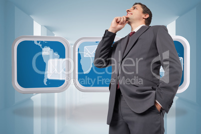 Composite image of thoughtful businessman with hand on chin