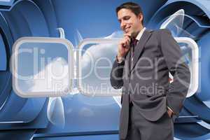 Composite image of thoughtful businessman with hand on chin