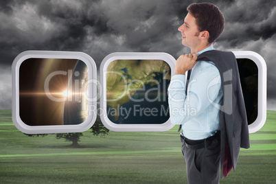 Composite image of smiling businessman holding his jacket