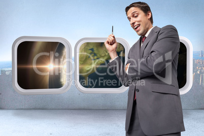 Composite image of thoughtful businessman holding pen