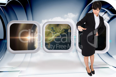 Composite image of businesswoman pointing