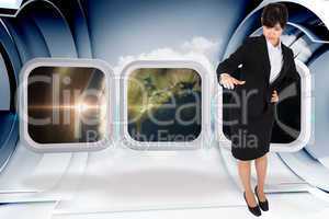 Composite image of businesswoman pointing