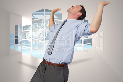 Composite image of businessman standing with hands up