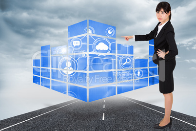 Composite image of businesswoman pointing