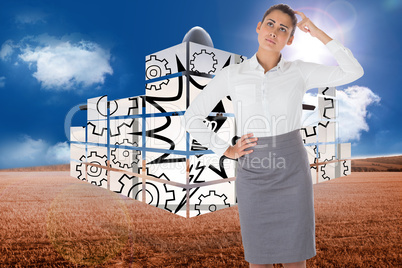 Composite image of focused businesswoman