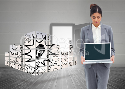 Composite image of businesswoman looking at laptop in her hands