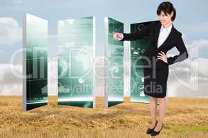 Composite image of smiling businesswoman pointing