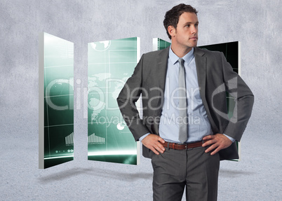 Composite image of serious businessman with hands on hips