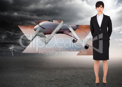 Composite image of serious businesswoman