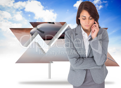 Composite image of focused businesswoman