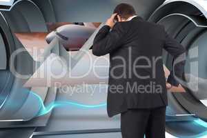 Composite image of thinking businessman scratching head