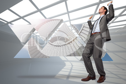 Composite image of businessman posing with hands up