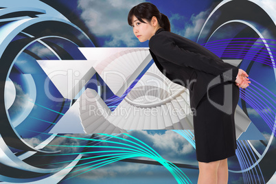 Composite image of serious businesswoman bending