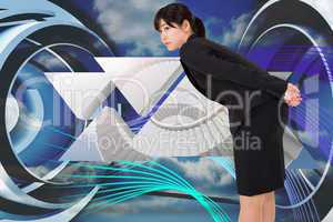 Composite image of serious businesswoman bending