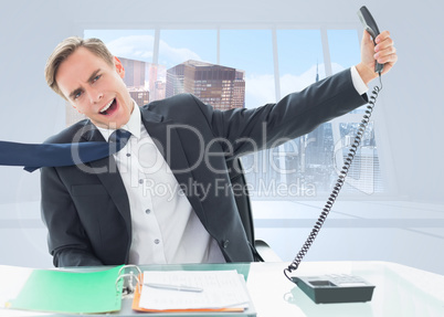 Composite image of businessman shouting as he holds out phone