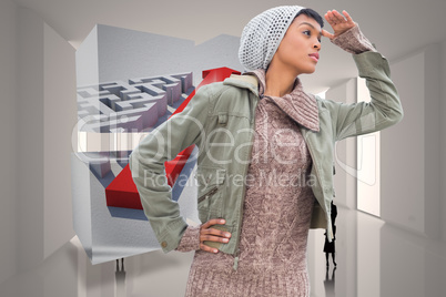 Composite image of concentrated young model in winter clothes wa