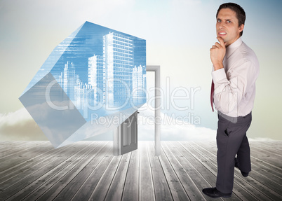 Composite image of thinking businessman touching his chin