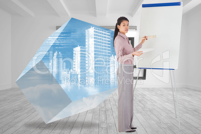 Composite image of businesswoman painting on an easel