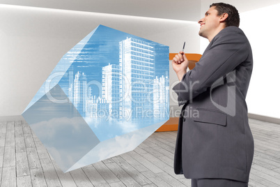 Composite image of thoughtful businessman holding pen