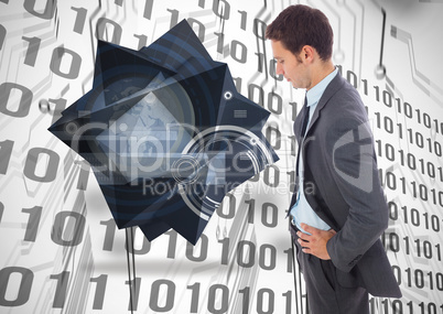 Composite image of serious businessman standing with hands on hi