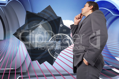 Composite image of thoughtful businessman with hand on chin