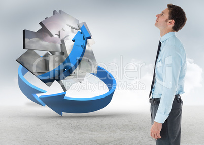 Composite image of serious businessman standing with hand in poc