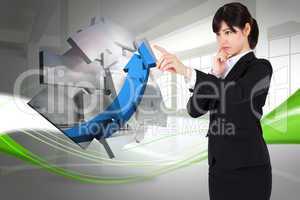 Composite image of thoughtful businesswoman pointing