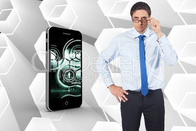 Composite image of thinking businessman tilting glasses