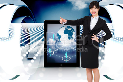 Composite image of smiling businesswoman pointing