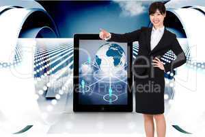 Composite image of smiling businesswoman pointing