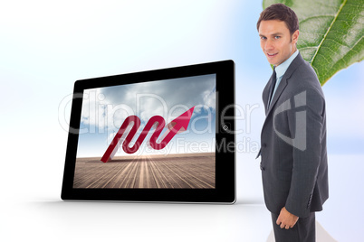 Composite image of cheerful handsome businessman standing