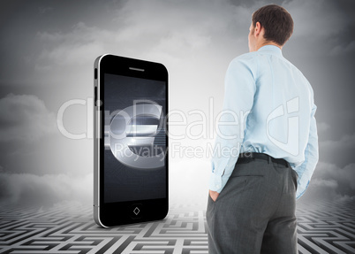 Composite image of businessman standing with hands in pockets