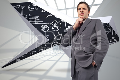 Composite image of thoughtful businessman with hand on chin